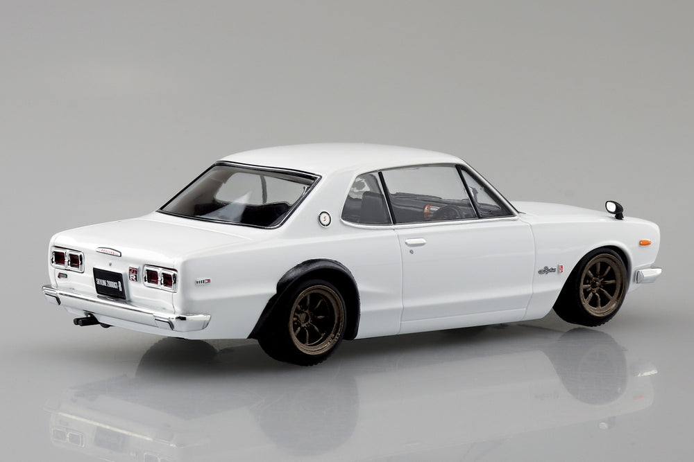 White Nissan Skyline 2000 GTR model vintage car on a gray background