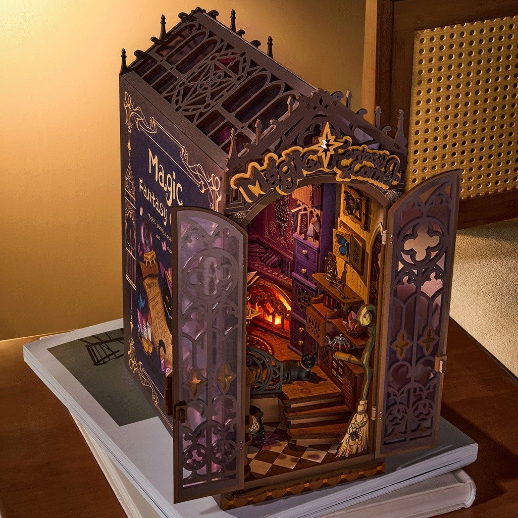 book nook wooden model of a magical book with open pages revealing a miniature world.