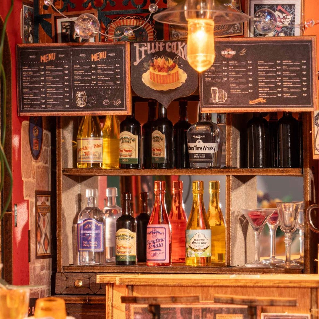 Wooden bar cabinet with liquor bottles and glasses, featuring a 'Bluff Cok' sign.