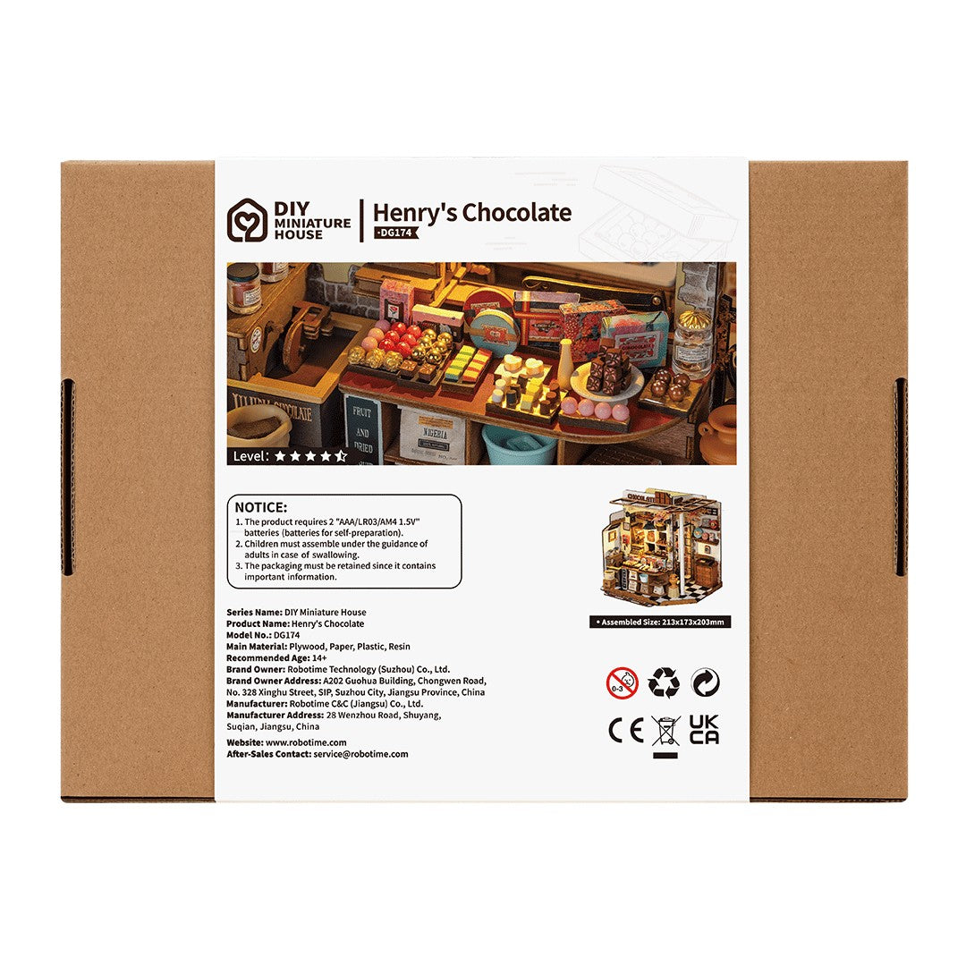 Box packaging for 'Henry's Chocolate' miniature house model with branding and product details.