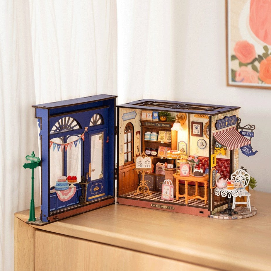 Open toy store model with detailed interior on a wooden surface.