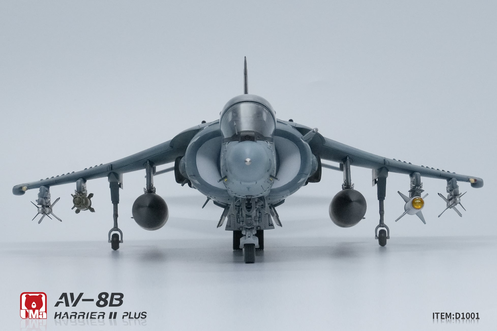 Model of an AV-8B Harrier II Plus aircraft on a gray background