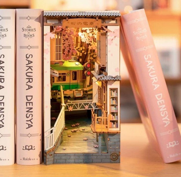 Rolife Sakura Densya DIY House Book Nook Model kit on book shelf