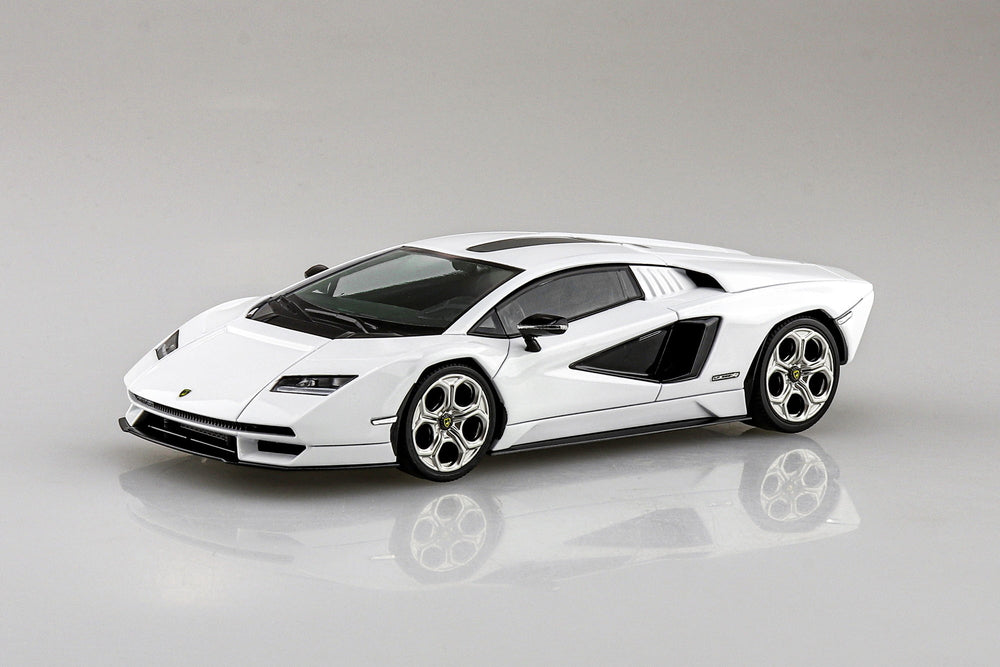 White aoshima snap fit lamborghini countach model kit built on a gray background