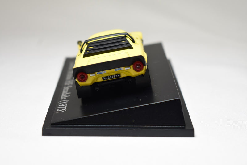 Atlas Editions Lancia Stratos HF Stradale 1973 yellow 1:43 scale diecast model on display stand rear