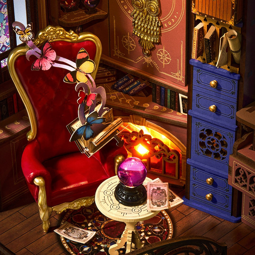 rolife magic fantasy corner book nook interior scene with a red chair, blue cabinet, and mystical objects.