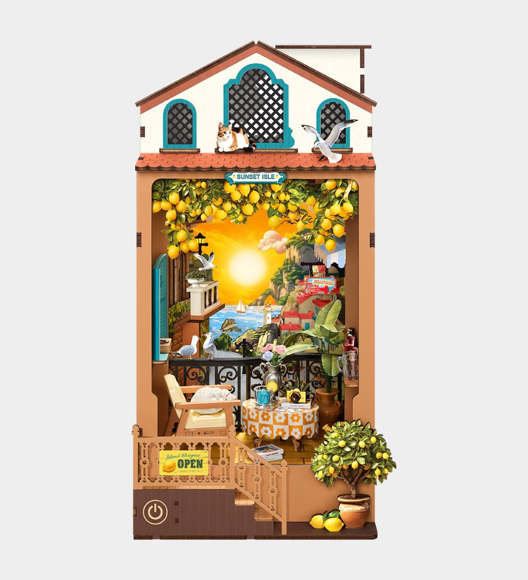 Decorative model of a house with lemon trees and people around, on a white background.