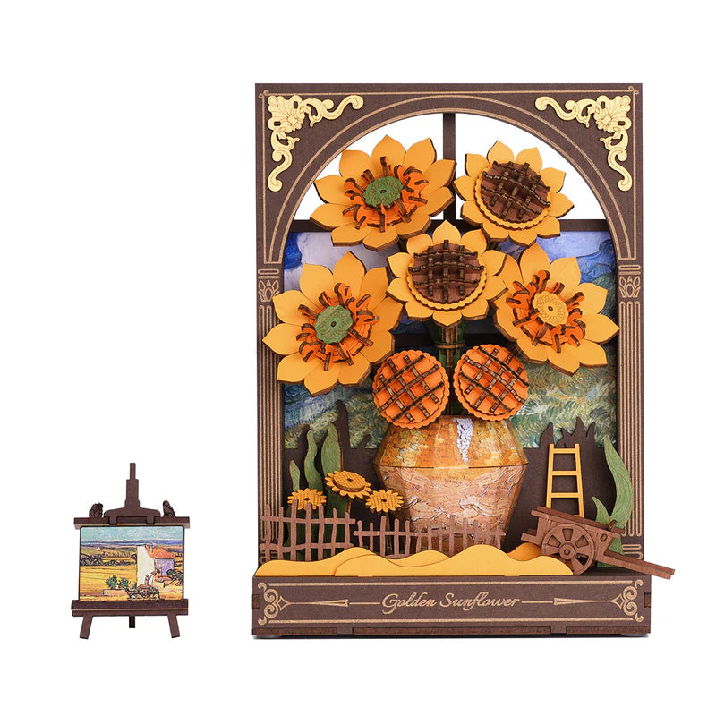 Decorative wall art with sunflowers and a vase, featuring a small easel with a painting on a white background.