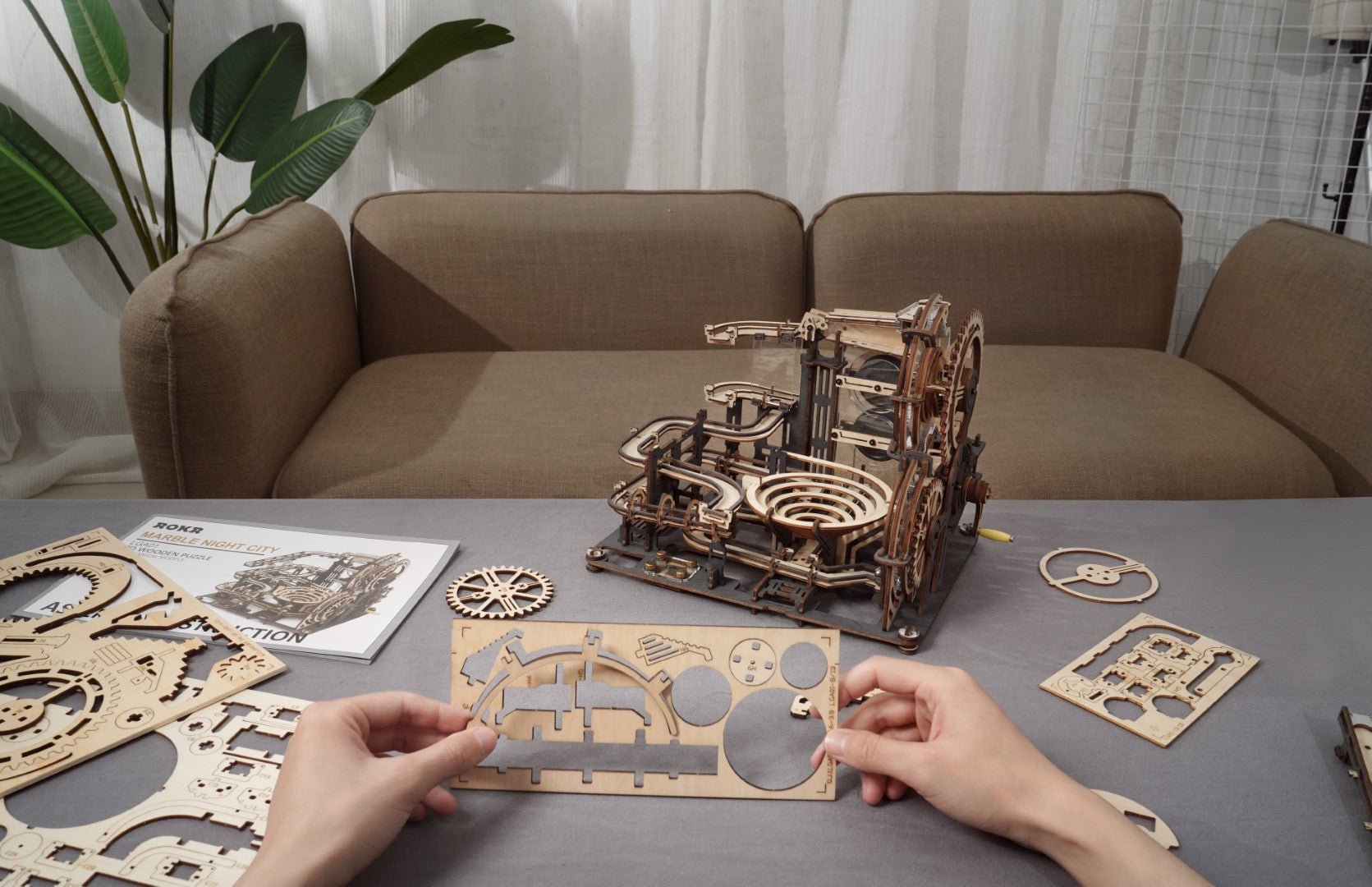 Rokr Marble Night City Wooden Puzzle model kit LGA01 being assembled