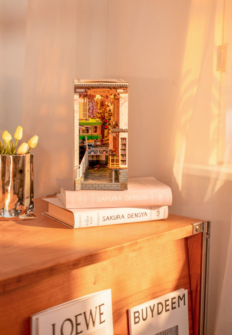 Rolife Sakura Densya DIY House Book Nook Model kit on shelf